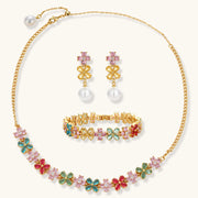 Garden Bloom Jewelry Set displayed with a floral pendant necklace, earrings, and bracelet, emphasizing the colorful zirconia stones and 14K gold plating by Astral Signature.