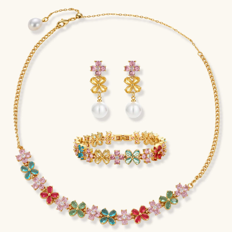 Garden Bloom Jewelry Set displayed with a floral pendant necklace, earrings, and bracelet, emphasizing the colorful zirconia stones and 14K gold plating by Astral Signature.