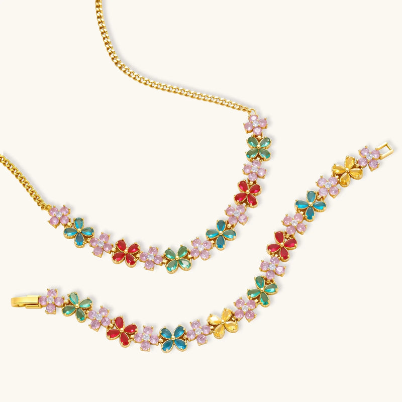 Garden Bloom Jewelry Set presented with a detailed view of a floral necklace and bracelet, showcasing colorful zirconia stones and gold accents by Astral Signature.