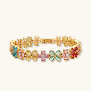 Stunning gold bracelet from the Garden Bloom Jewelry Set, featuring floral designs and colorful zirconia, crafted by Astral Signature.