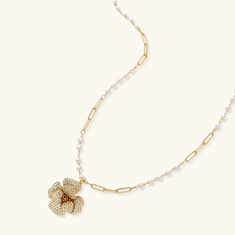 Close-up view of the floral pendant from the Blooming Elegance — Blue and Pearl Jewelry Set in 14K Gold by Astral Signature™, highlighting zirconia and pearl details.