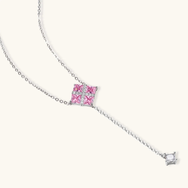 Elegant Pink Prism Cross Set jewelry by Astral Signature, showcasing the pendant necklace and pink zirconia design.