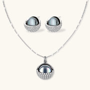 Sphere Luxe Set by Astral Signature features a stunning silver necklace and matching earrings with a sculptural design and zirconia detailing.