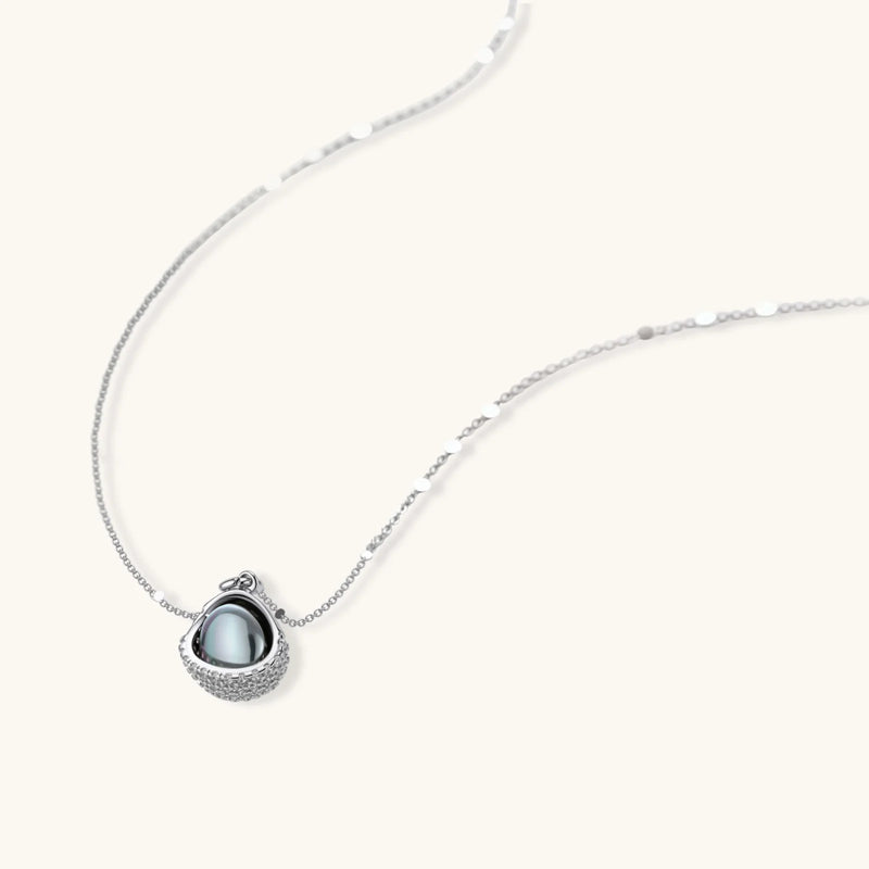 A detailed view of the silver pendant necklace from the Sphere Luxe Set by Astral Signature, showcasing its premium zirconia embellishments.