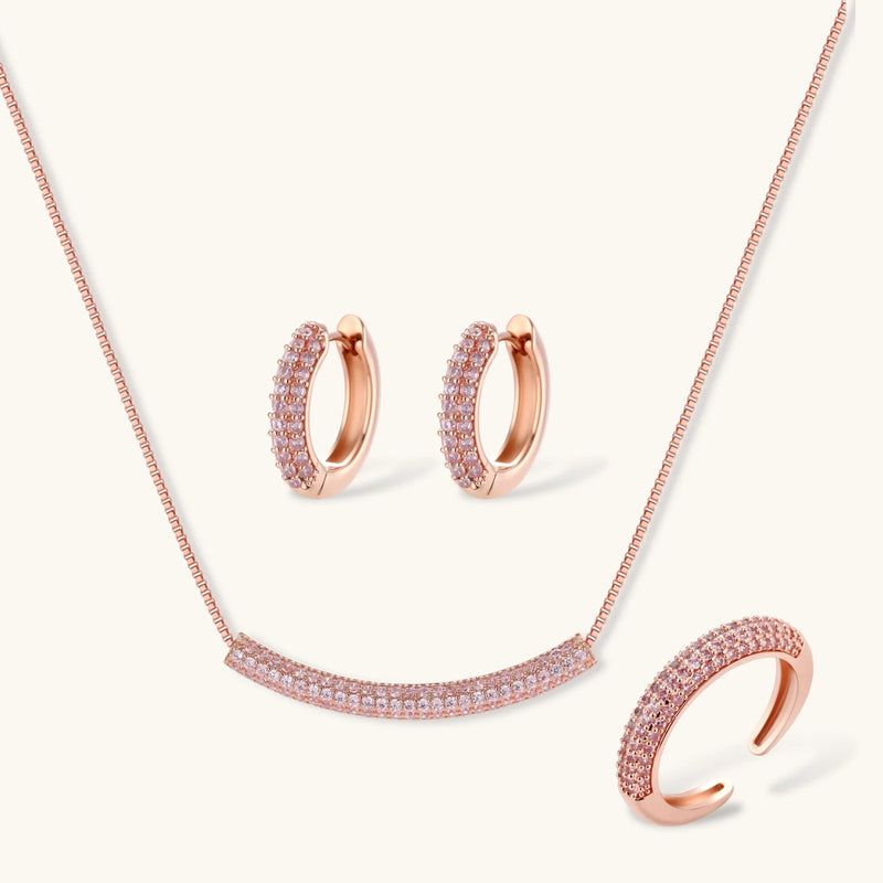 Sparkling Confidence Set by Astral Signature™ featuring a rose gold plated necklace, stud earrings, and adjustable ring, adorned with zirconia for a luminous look.
