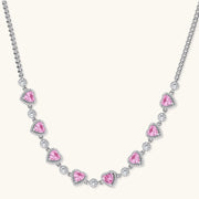 A sophisticated necklace from the Romance Heart Set showcasing heart-shaped pink zirconia stones and shimmering accents, crafted by Astral Signature™ jewelry.