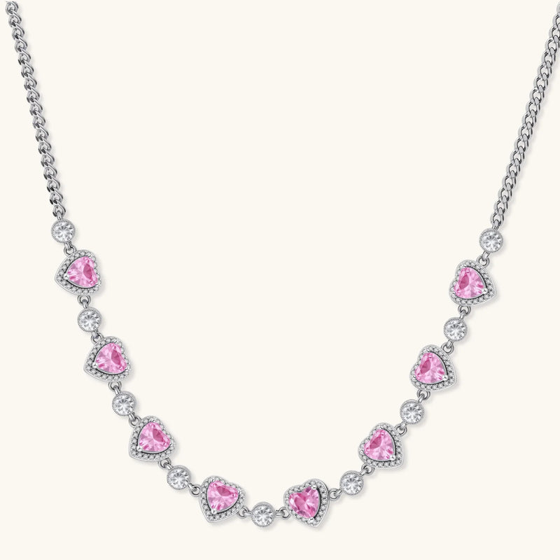 A sophisticated necklace from the Romance Heart Set showcasing heart-shaped pink zirconia stones and shimmering accents, crafted by Astral Signature™ jewelry.