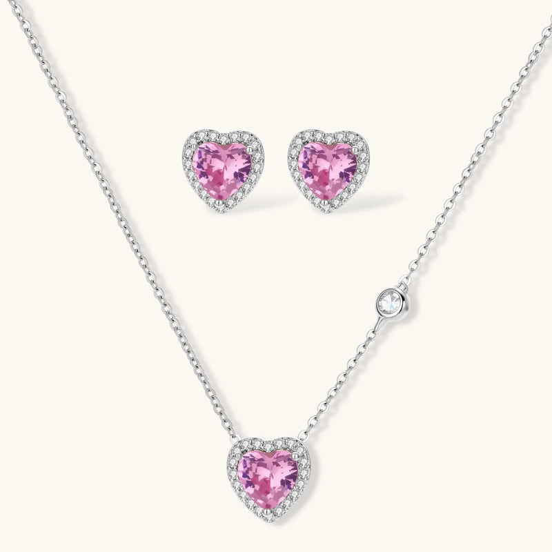 A gorgeous arrangement of the Romance Heart Set consisting of heart-shaped earrings and a matching necklace, all elegantly crafted with pink zirconia, from Astral Signature™, aiming to enhance beauty and charm.