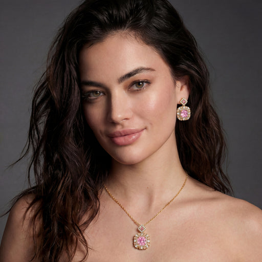 Model showcasing the heirloom square gold jewelry set with a pink zirconia necklace and earrings by Astral Signature, emphasizing modern elegance.