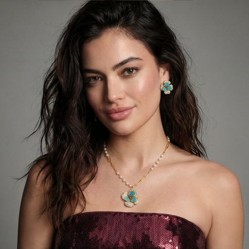Model wearing Blooming Elegance — Blue and Pearl Jewelry Set in 14K Gold by Astral Signature™, showcasing the floral necklace and earrings combination.