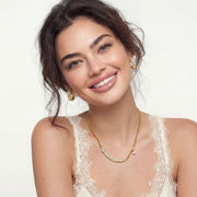 Model wearing the Geometric Luxe Set, including a necklace and earrings, styled for a sophisticated look by Astral Signature.