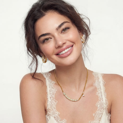 Model wearing the Geometric Luxe Set, including a necklace and earrings, styled for a sophisticated look by Astral Signature.