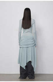 Back view of the model wearing the Dreamy Ball Wool Dress by PremiumStyle Co.,Limited, highlighting the graceful draping and light gray hue. This stunning Asymmetric Hem Wool Dress encapsulates sophisticated women's fashion for versatile styling.