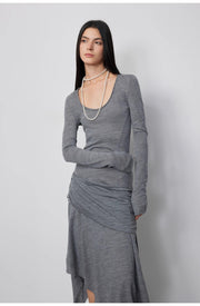 Close-up of the model wearing the Dreamy Ball Wool Dress by PremiumStyle Co.,Limited in dark gray, emphasizing the sophisticated design and flow of the asymmetric hem. This Asymmetric Hem Wool Dress is an essential for refined women's clothing.