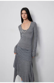 Profile view of the model wearing the Dreamy Ball Wool Dress by PremiumStyle Co.,Limited in dark gray. The gown’s asymmetric hem adds a unique touch, solidifying its status as a contemporary Asymmetric Hem Wool Dress in women's clothing.