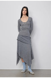 Sophisticated pose of the model dressed in the Dreamy Ball Wool Dress by PremiumStyle Co.,Limited, emphasizing the dark gray asymmetric hemline. This Asymmetric Hem Wool Dress encapsulates elegance in modern women's fashion.