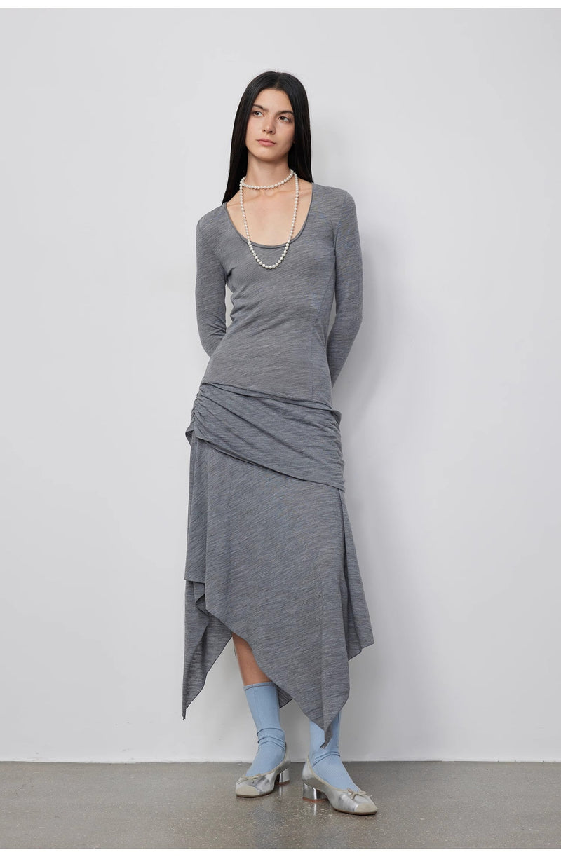 Sophisticated pose of the model dressed in the Dreamy Ball Wool Dress by PremiumStyle Co.,Limited, emphasizing the dark gray asymmetric hemline. This Asymmetric Hem Wool Dress encapsulates elegance in modern women's fashion.