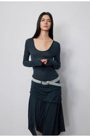 Model elegantly posed in the Dreamy Ball Wool Dress by PremiumStyle Co.,Limited wearing a dark blue gown accentuated by an asymmetric hem. This standout Asymmetric Hem Wool Dress showcases exquisite craftsmanship in women’s clothing.