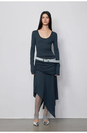 Close-up of the model in the Dreamy Ball Wool Dress by PremiumStyle Co.,Limited, featuring luxurious dark blue fabric and an asymmetrical design. This stylish Asymmetric Hem Wool Dress is a significant statement in sophisticated women's fashion.