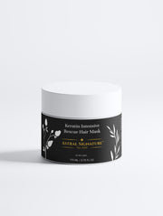 Keratin Intensive Rescue Hair Mask by Astral Signature, packaged in a white jar, suitable for all skin types and designed for deeply nourishing dry ends. This hair mask enhances shine and smoothness, helping to reduce breakage and split ends with its keratin, peptides, and wheat protein active ingredients. The natural certified formula addresses the lack of glow, providing a luxurious hair-care experience.