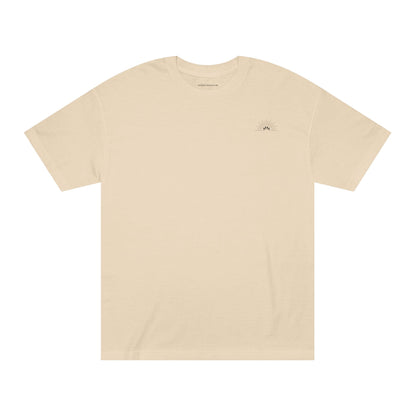 Unisex Classic Logo Tee – Sunrise by Astral Signature in soft beige, displaying its classic silhouette. This everyday tee is ideal for casual outings, embodying a minimal and gender neutral style for all wearers.
