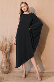 Model showcasing the Matte Crepe One Sleeve Dress by TYCHE in a stylish black design, perfect for any occasion. This elegant piece is part of NEW ARRIVALS in Women's Clothing, ideal as a Gift for Her. APPAREL, Black, CCPRODUCTS, DRESSES, One Sleeve Dress, Women's, Women's top.