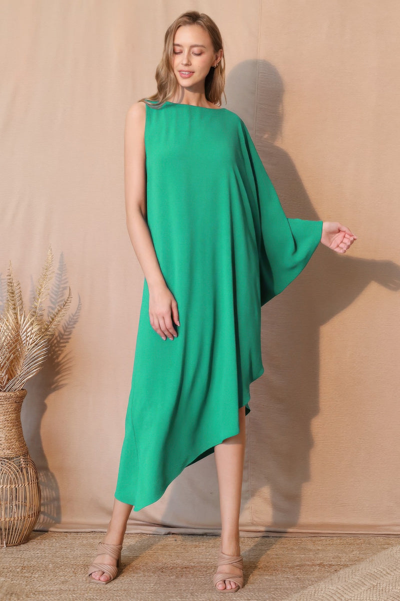 A model showcasing the TYCHE Matte Crepe One Sleeve Dress in vibrant green, exemplifying modern elegance with its asymmetrical silhouette. This dress is categorized under APPAREL, CCPRODUCTS, Dress, DRESSES, Green, Matte Crepe One Sleeve Dress, NEW ARRIVALS, One Sleeve Dress, Women's Clothing.