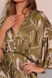 Close-up of the fabric and design of Astral Women's Jumpsuit - Olive Bloom Floral Satin Cape, highlighting its luxurious satin texture and intricate detailing. A standout piece from TYCHE, perfect for fashionable women. APPAREL, CCPRODUCTS, JUMPSUITS & ROMPERS, NEW ARRIVALS, Olive, Satin Cape, Women's Clothing, Women's Jumpsuit, Women’s.