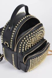 Inside look of the Studded Backpack with Chain Zipper by HD ACCESSORIES, demonstrating spacious compartments lined with gold studs. This fashionable handbag is part of the new arrivals and perfect for stylish accessories enthusiasts.