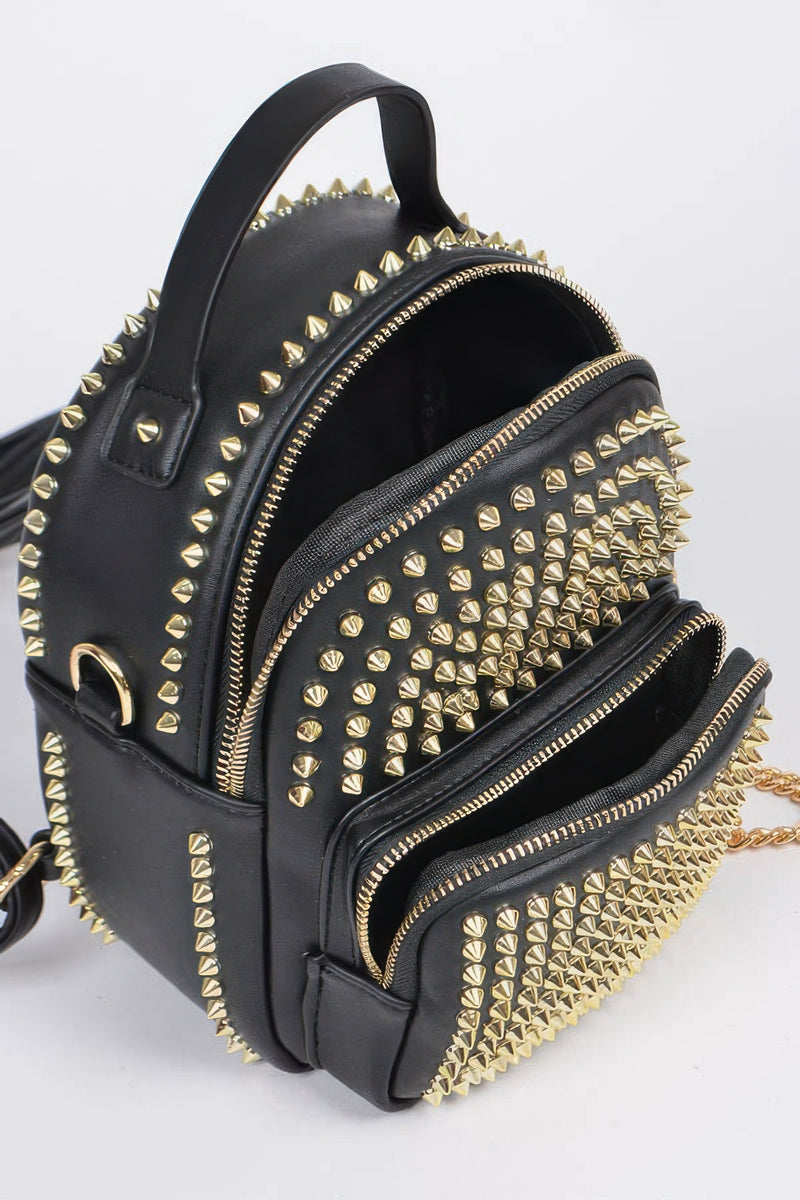 Inside look of the Studded Backpack with Chain Zipper by HD ACCESSORIES, demonstrating spacious compartments lined with gold studs. This fashionable handbag is part of the new arrivals and perfect for stylish accessories enthusiasts.