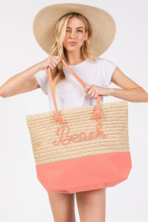 A model showcasing the Rope Handle Beach Tote, crafted by HD ACCESSORIES, featuring a stylish crochet design with 'Beach' lettering in Coral. This spacious Tote Bag is perfect for summer outings, ideal for beach-goers. Discover this beautiful addition to your summer wardrobe that fits right in with NEW ARRIVALS in various hues including Blue and Hot Pink.