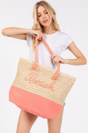 A model effortlessly carrying the Rope Handle Beach Tote crafted by HD ACCESSORIES in a stunning Coral color, featuring beach-inspired lettering. This trendy Beach Tote Bag combines functionality with chic design, available in colors such as Hot Pink and Orange, perfect for summer escapades.