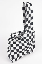 Side view of a black and white Japanese Knot Bag — Chic Checker Woven by HD ACCESSORIES, featuring a unique knot design. This bag emphasizes the Japanese Knot Bag Style with its sophisticated checker pattern and trendy silhouette. ACCESSORIES, Bag, Black, CCPRODUCTS, Chic Checker Poly Woven, HANDBAGS, NEW ARRIVALS.
