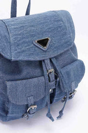 Detailed view of the medium blue denim double pocket front backpack by HD ACCESSORIES, highlighting its structural design and practical features. This Backpack, perfect for everyday carry, combines the look of a bag and the functionality of an accessory. Ideal for casual outings and a must-have from our NEW ARRIVALS.