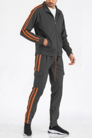 Men's Tracksuit by WEIV displayed in charcoal grey with vibrant orange stripes, part of the Two Stripe Utility Pocket Track Suit. This design combines style and utility for an active lifestyle, making it a unique addition to your wardrobe. Active, Activewear, Black lime, Black orange, Black red, Black white, Black yellow, CCPRODUCTS, Gift for Him, MENS, MENS SETS, Navy white, NEW ARRIVALS, Red white.