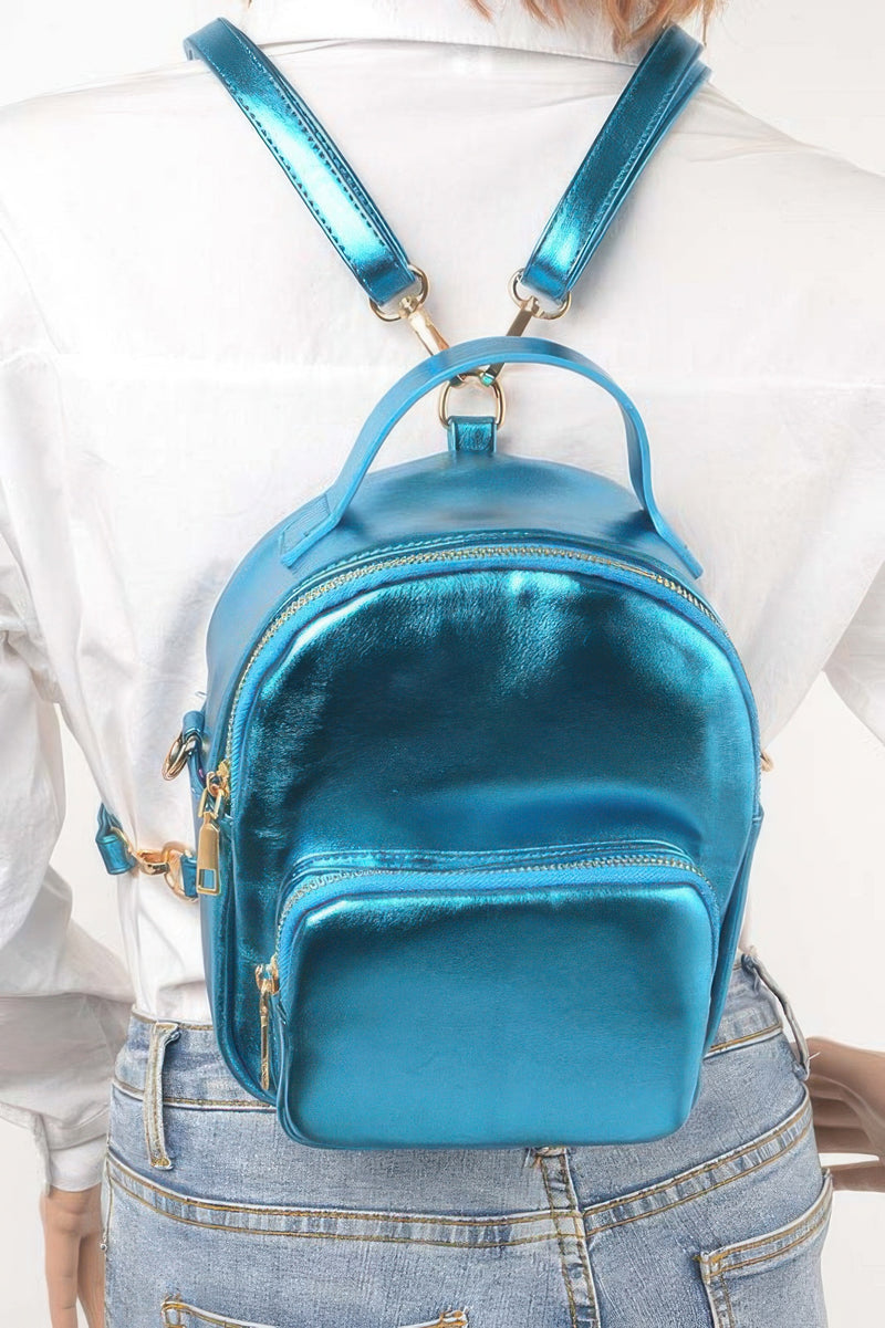 Model showcasing a blue metallic backpack from HD ACCESSORIES, featuring adjustable straps for a personalized fit. This stylish Backpack complements casual outfits and is an essential addition to your #ACCESSORIES wardrobe.