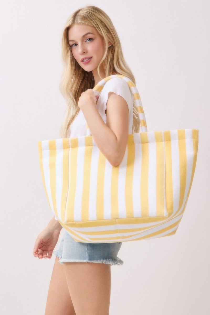 A close-up of the Astral Signature™ logo, representing quality and style in the Beach Tote Bag - Striped Tote Bags by HD ACCESSORIES. Explore a collection of stylish accessories, perfect for everyday adventures.