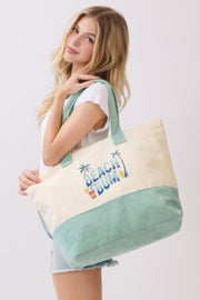 Model showcasing the Beach Tote Bag in Green by HD ACCESSORIES, highlighting its spacious design and vibrant graphics. An essential for summer outings. ACCESSORIES, Beach Bum Tote Bag, Beach Tote Bag, Beach Tote Bag in Green, Beach Tote Bag in Green - Beach Bum, CCPRODUCTS, Green, Green Tote Bag, HANDBAGS, NEW ARRIVALS, Tote Bag.