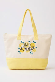 The Beach Tote Bag in Yellow by HD ACCESSORIES features a cheerful 'Hello Summer' slogan with lemon motifs, perfect for warm-weather outings. This stylish accessory is part of the new arrivals collection.