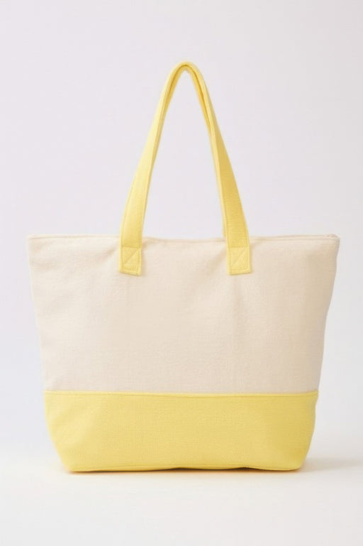 A simple rear view of the Beach Tote Bag in Yellow from HD ACCESSORIES, showcasing its spacious design ideal for everyday use. This handbag is a must-have from the new arrivals.