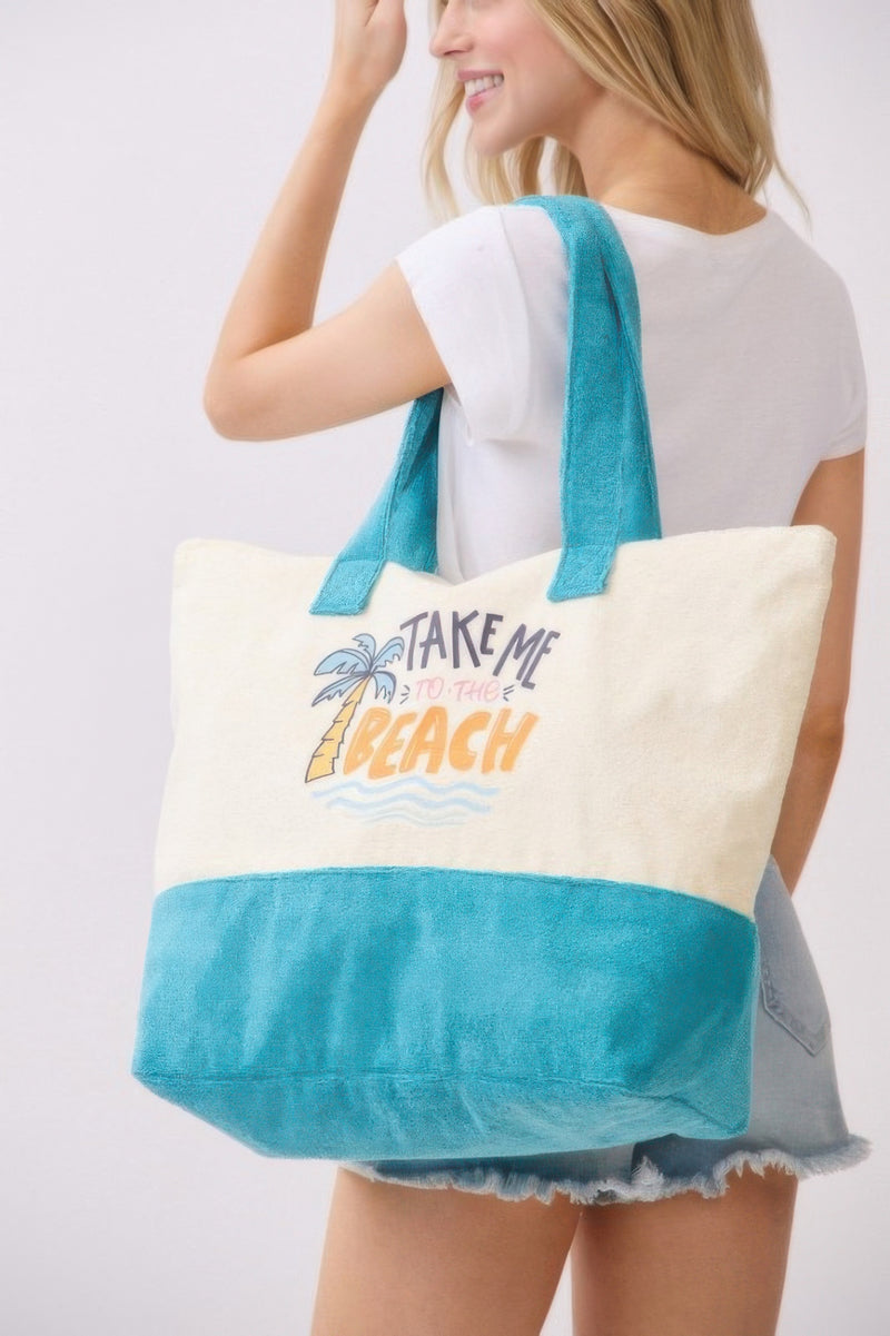 Beach Tote Bag in Blue held by a model, emphasizing the playful graphic and spacious design. Designed by HD ACCESSORIES, this Beach Tote Bag in Blue is perfect for all your summer adventures, from beach trips to casual outings. With its trendy aesthetic and practical features, it is a great addition to any summer wardrobe. Explore more in the HANDBAGS section of NEW ARRIVALS.