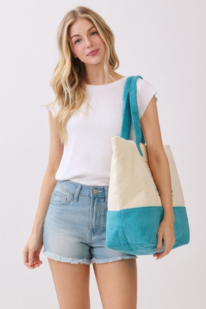 Woman presenting the Beach Tote Bag in Blue - Life Is Better At The Beach by HD ACCESSORIES, highlighting its stylish design and spacious interior, perfect for casual use. Part of ACCESSORIES, Beach Tote Bag, Blue, CCPRODUCTS, HANDBAGS, NEW ARRIVALS, Tote Bag.