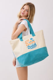 Model showing off the Beach Tote Bag in Blue - Life Is Better At The Beach by HD ACCESSORIES, illustrating its roomy interior and trendy look for beach lovers. Fits within ACCESSORIES, Beach Tote Bag, Blue, CCPRODUCTS, HANDBAGS, NEW ARRIVALS, Tote Bag.