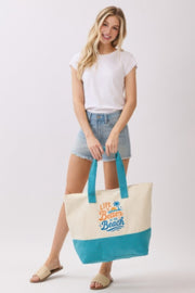 Model displaying the Beach Tote Bag in Blue - Life Is Better At The Beach from HD ACCESSORIES, showing its perfect size for carrying essentials. A beautiful accessory for summer, categorized as ACCESSORIES, Beach Tote Bag, Blue, CCPRODUCTS, HANDBAGS, NEW ARRIVALS, Tote Bag.