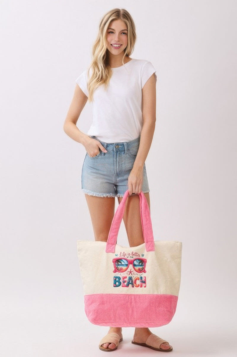 The model poses neatly with the Life Is Better At The Beach Tote Bag from HD ACCESSORIES. The fun design combined with its roomy interior makes it an essential tote for summer adventures and a stylish accessory among handbags and new arrivals.