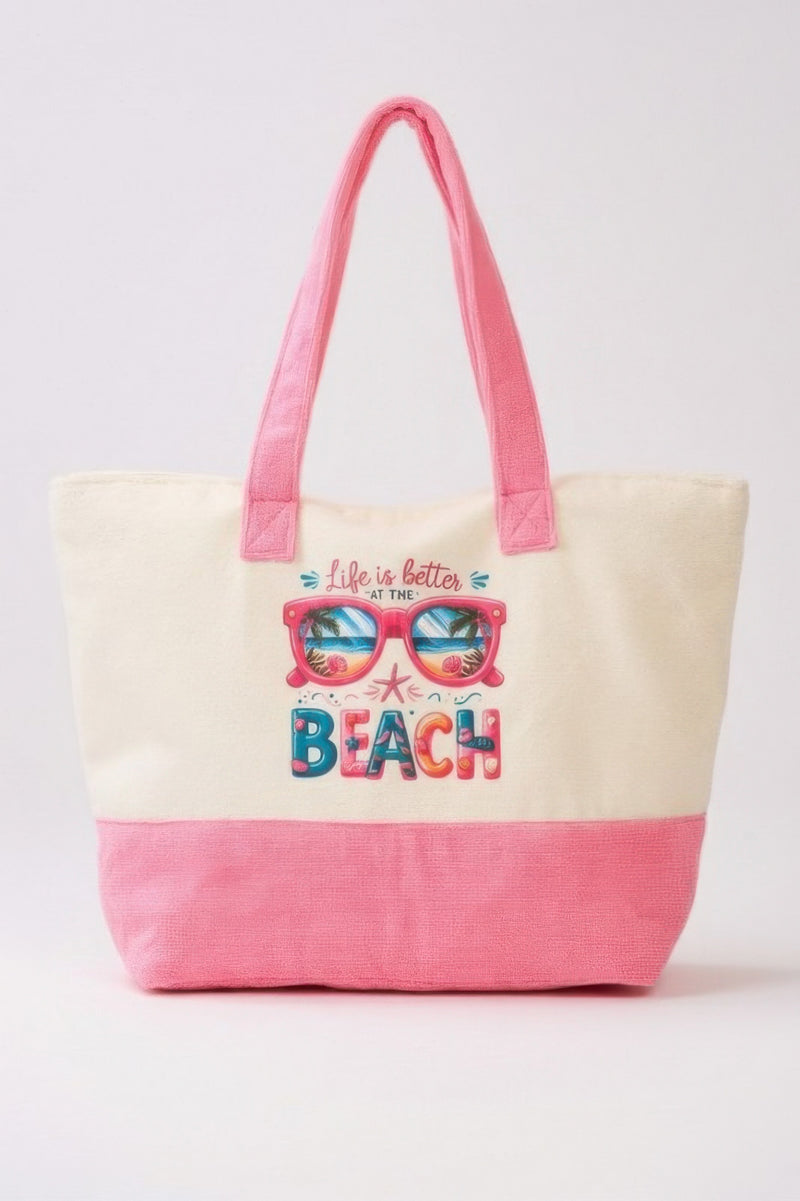 The Life Is Better At The Beach Tote Bag by HD ACCESSORIES features a vibrant design with beach-themed graphics. This roomy tote bag showcases soft terrycloth material in delightful pink, perfect for summer outings. Ideal for anyone looking for stylish accessories, handbags, and new arrivals.