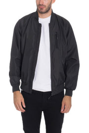 Model showcasing a Black Lightweight Windbreaker Jacket from Astral Signature™, perfect for any casual or outdoor occasion. Keywords: Windbreaker Jacket, Black, Burgundy, CCPRODUCTS, Grey, MENS, MENS OUTERWEAR, MENS TOPS, NEW ARRIVALS.