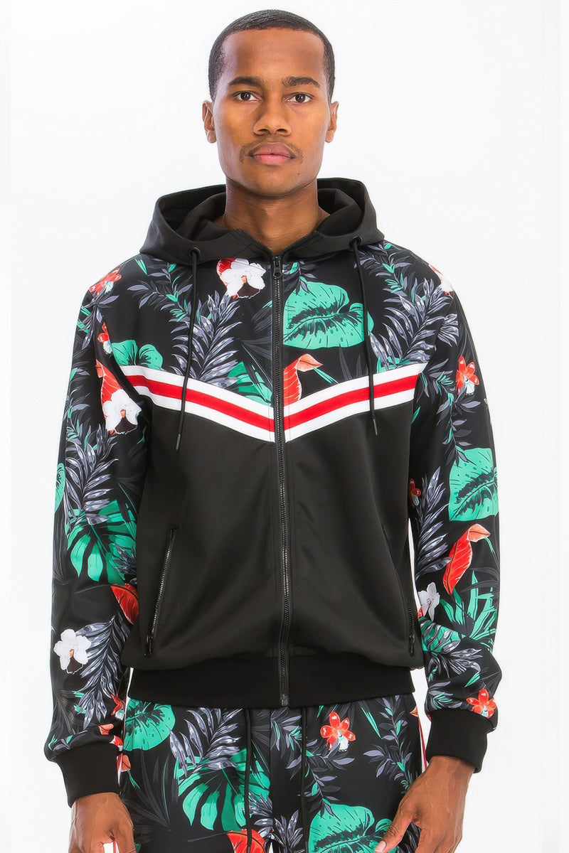 Close-up of a male model wearing the hooded jacket from the Printed Polyester Track Set for Men by Astral Signature™, emphasizing vibrant floral prints and athletic style. A versatile addition to your activewear wardrobe. Active, Activewear, Black, CCPRODUCTS, MENS, MENS SETS, NEW ARRIVALS, Track Set.