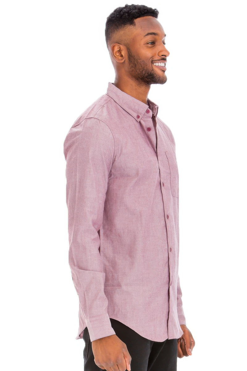 Side view of a man wearing a Heather Burgundy long sleeve shirt from Astral Signature™, showcasing its fit and comfort. This Long Sleeve Shirt is made from a breathable cotton-polyester blend, ideal for casual wear. Included in categories like CCPRODUCTS, H.Burgundy, MENS, MENS TOPS, and NEW ARRIVALS.