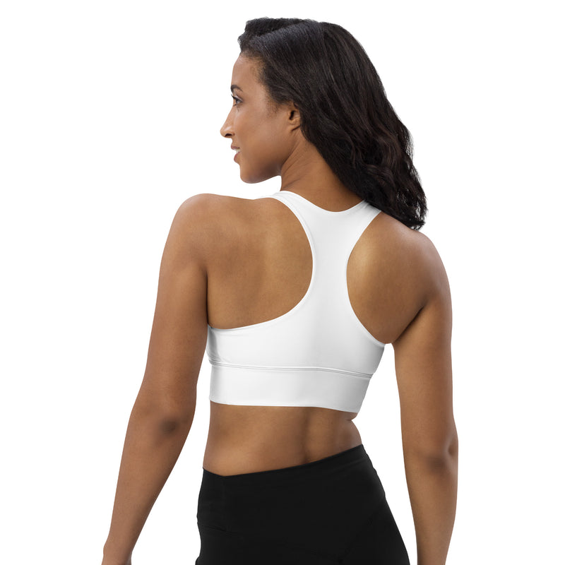 Model showing the back of the Astral Signature Longline Sports Bra, capturing the sleek design for enhanced support during athletic activities.